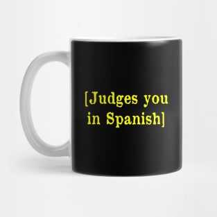 Judges you in Spanish Mug